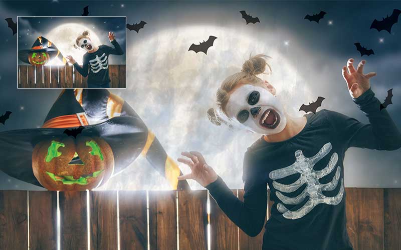A girl in a halloween makeover with bats flying in the background