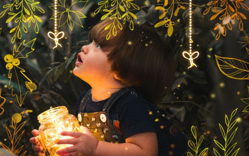 string lights and christmas holiday overlays on an image of a kid