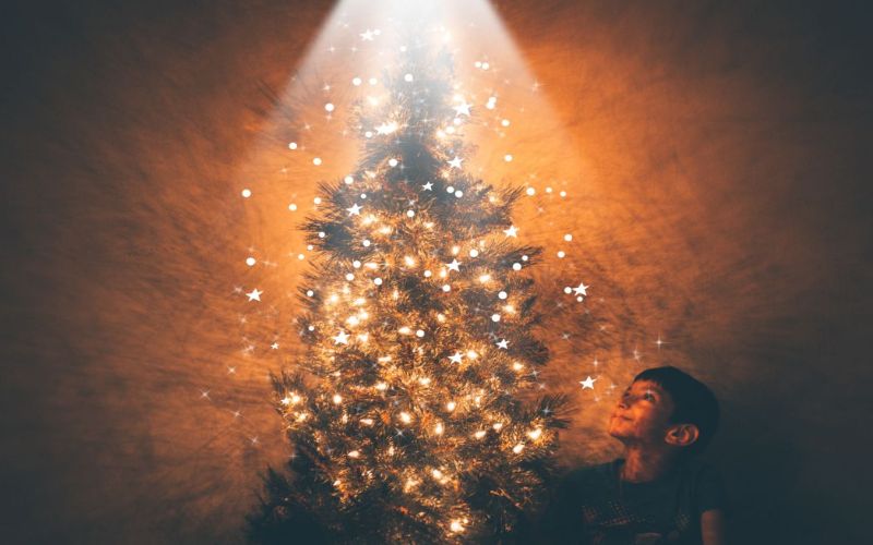 stars overlay on a christmas tree