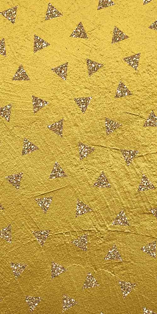 triangle cutouts on gold background