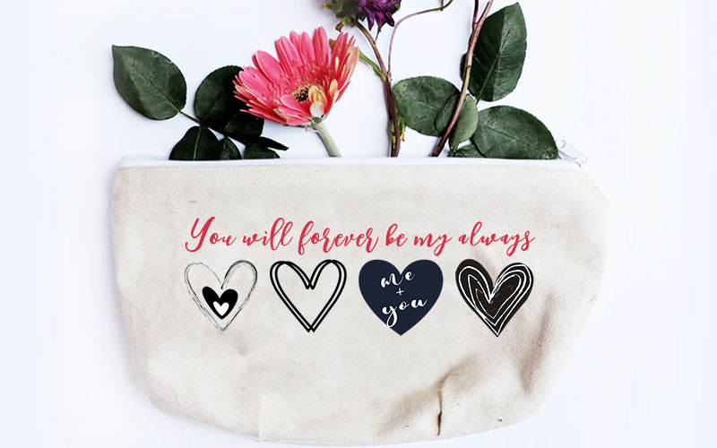 A preview of a hand purse after designing it with the free outline heart and black heart SVGs
