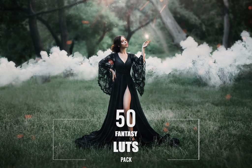woman in a black long dress with a trailer and lace sleeves. magic. witchcraft. leg, slender figure.stealing soul, spirit hunter, fire in hands, sparks, mysteries, smoke, forest, art photo. sun light