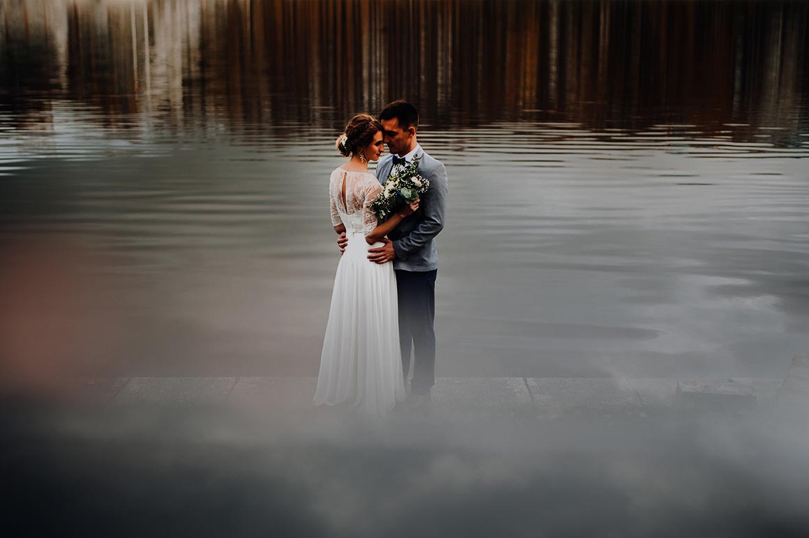 couple in water, standing closely