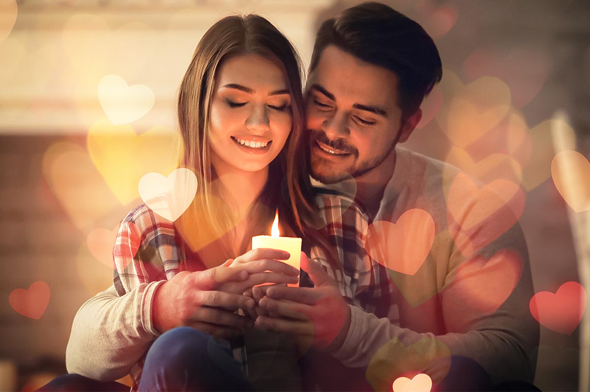 couple hoding candle