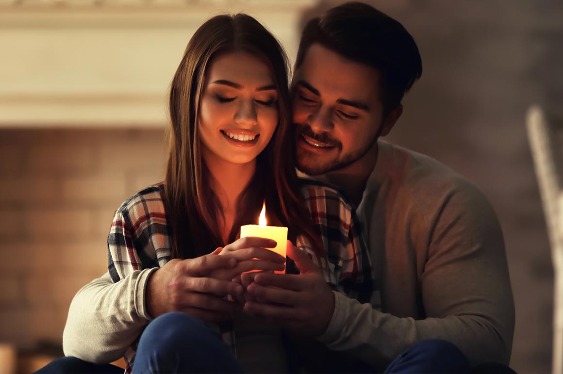 couple holding candle but not edited