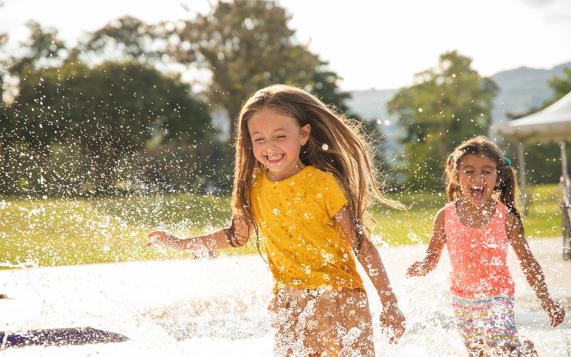 kids playing in splash of water
