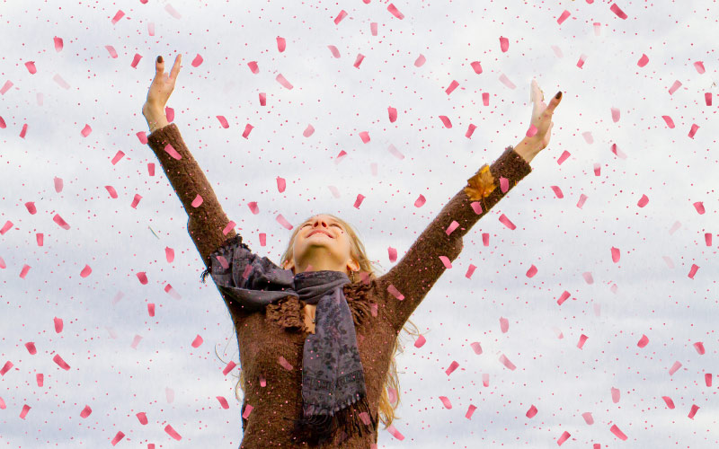 An image of a young happy girl under the sky
