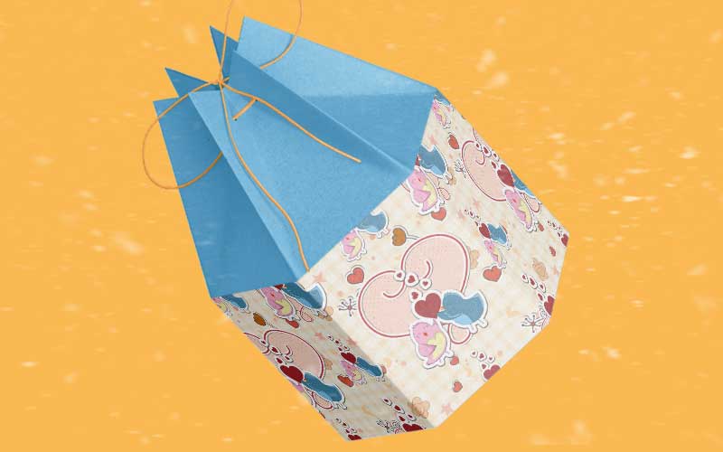 A preview of an animal pattern of  colorful birds used on a small blue hand pouch