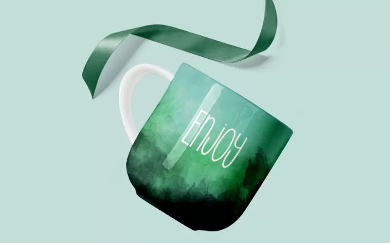 A preview of a green watercolor background included in the abstract watercolor backgrounds used to design a cup