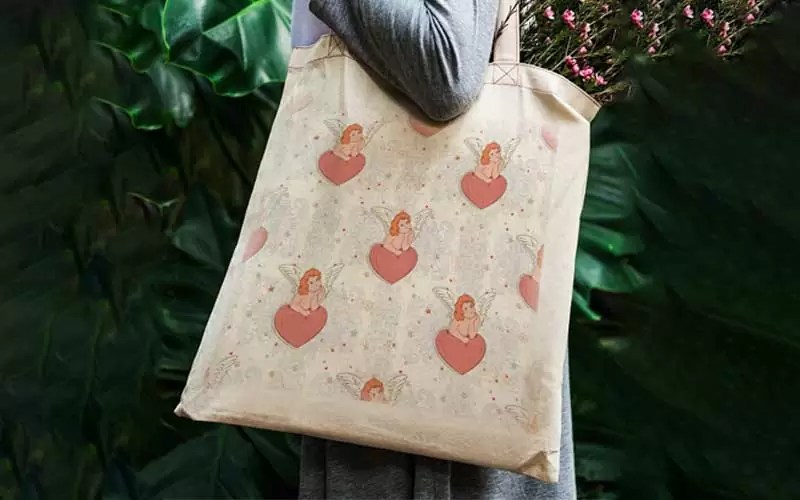 A preview of an angel baby with wings modern seamless pattern used on a hand bag